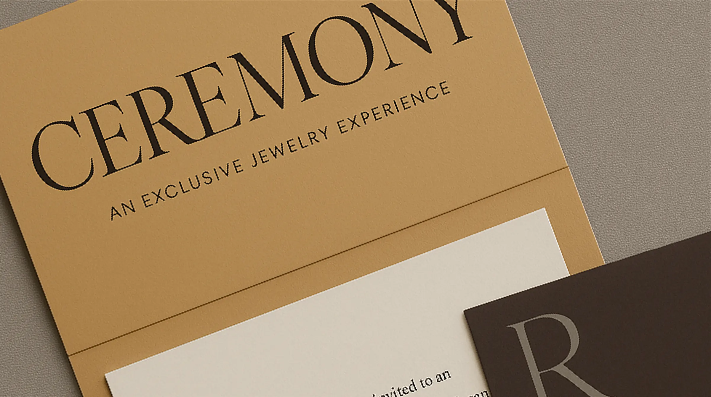 Ceremony “An exclusive jewelry experience” invitation card in gold and brown